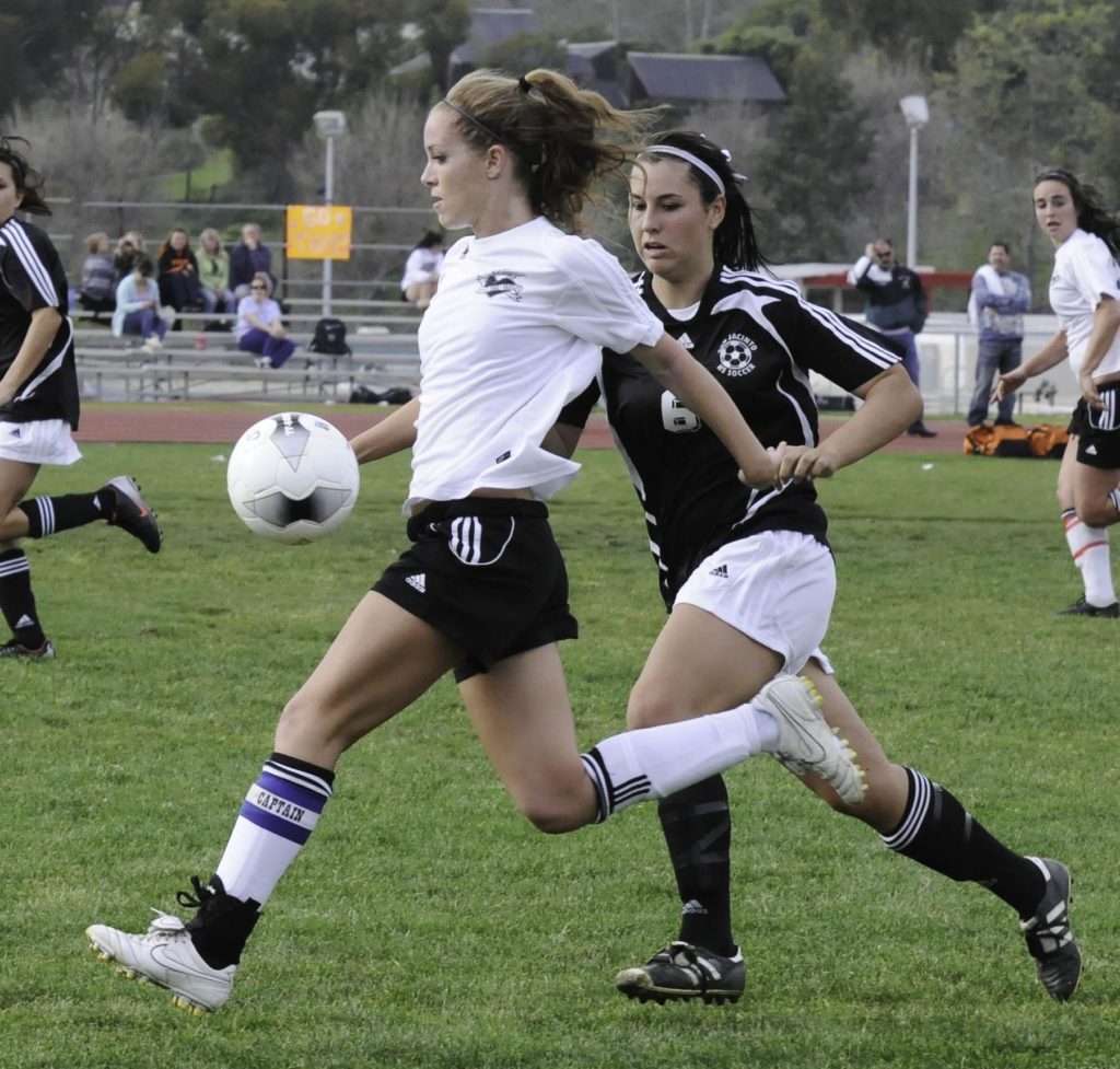 Claire haft playing high school soccer